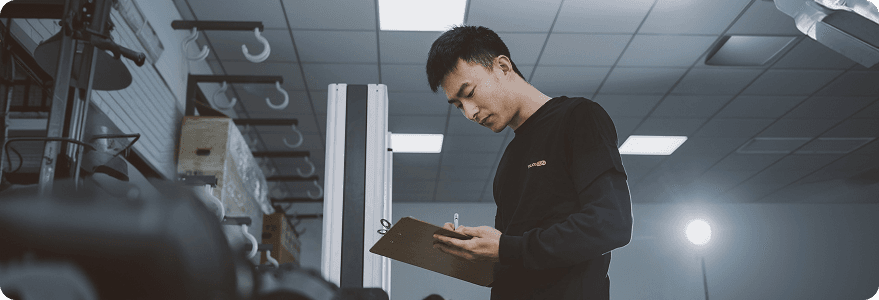 Auditor reviewing a checklist in a facility