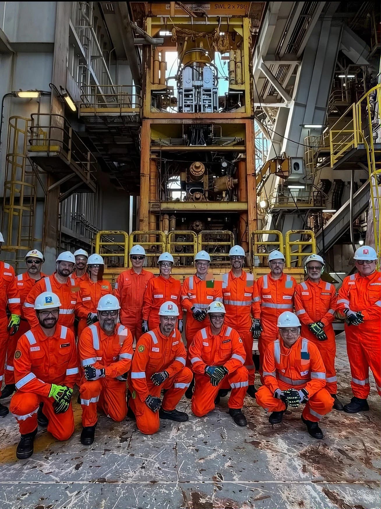 Offshore crew gathered on a platform deck
