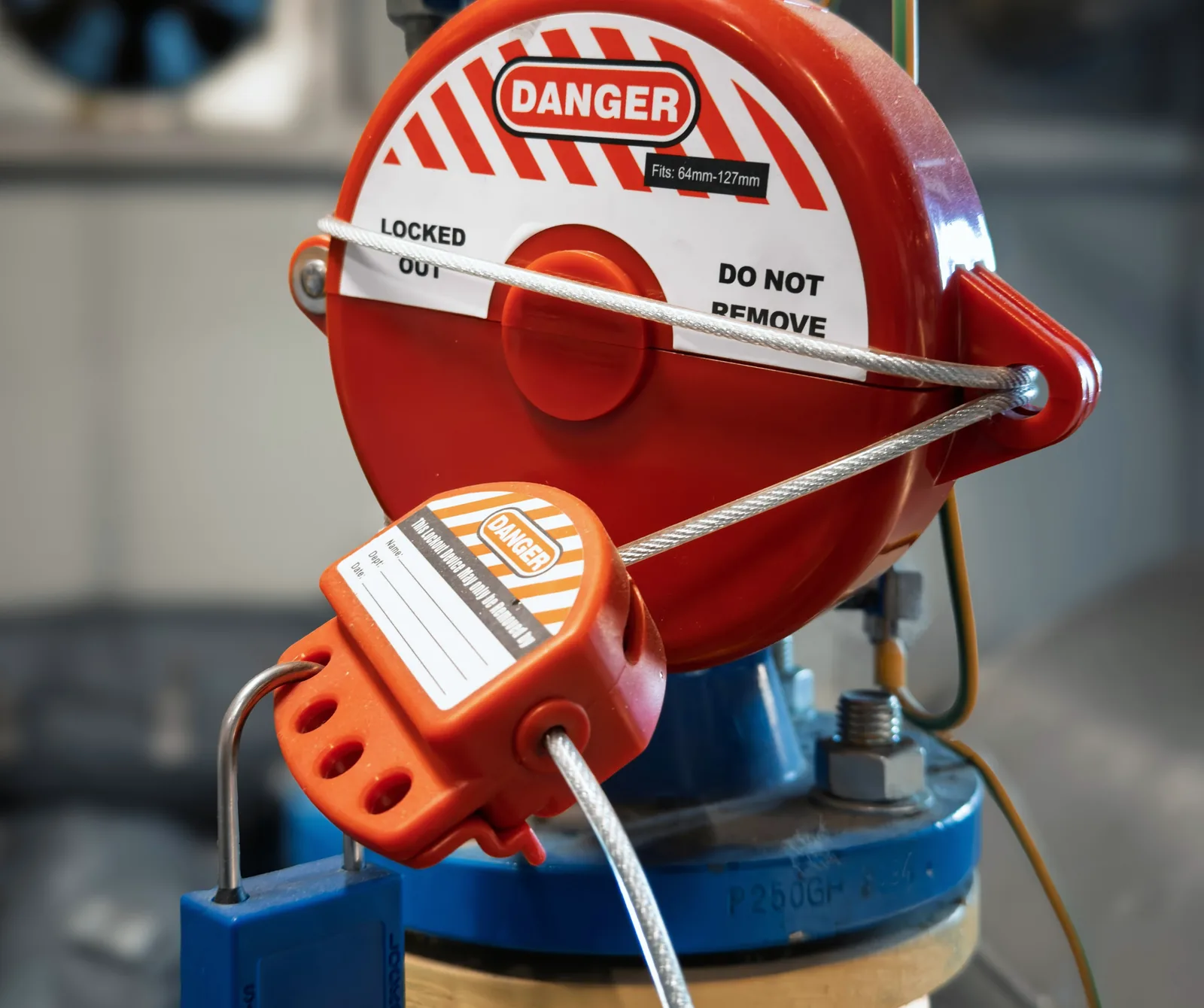 Valve locked out with a padlock, cable lock and danger tag