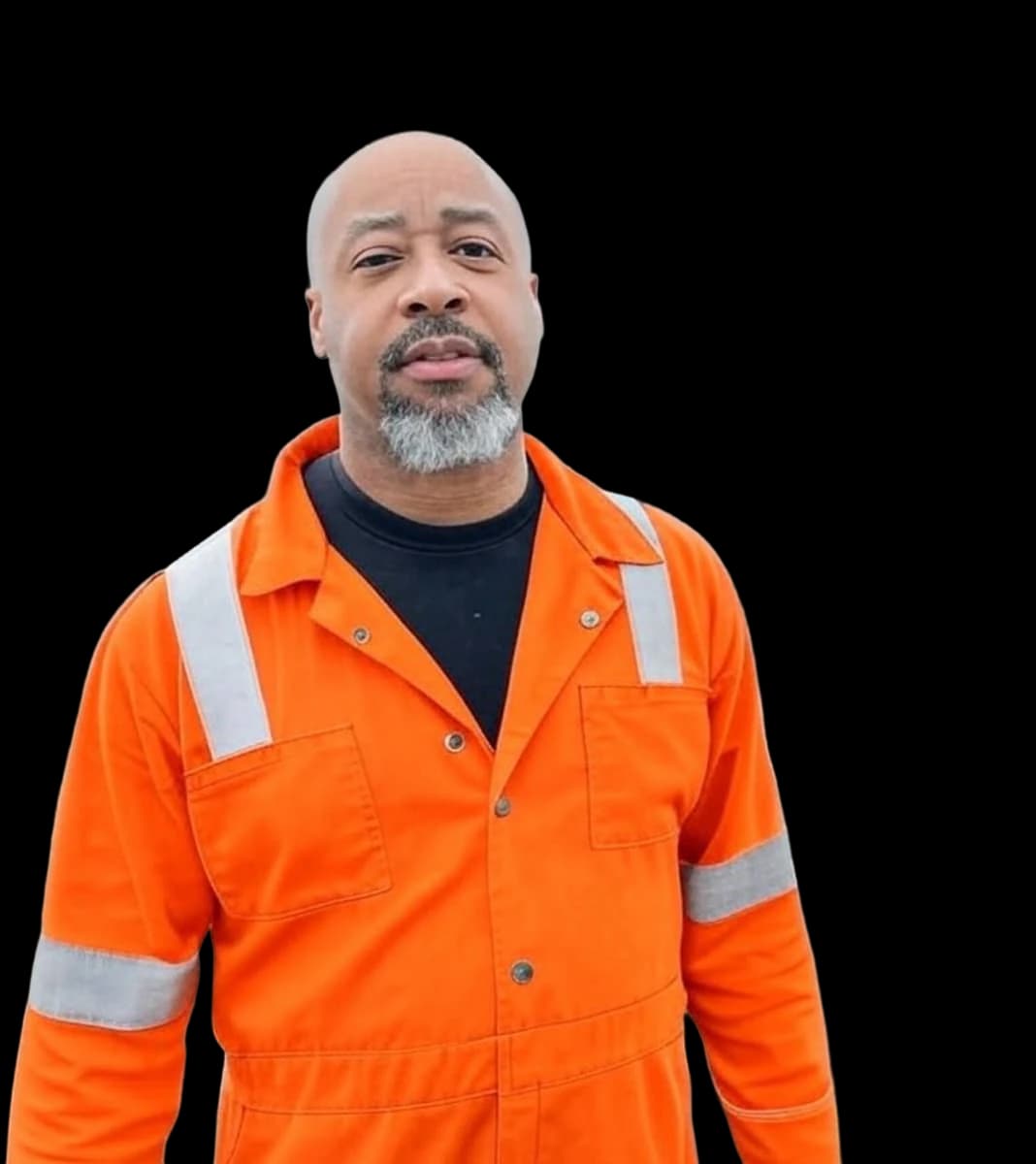 Oil and gas worker in an orange high-visibility coverall