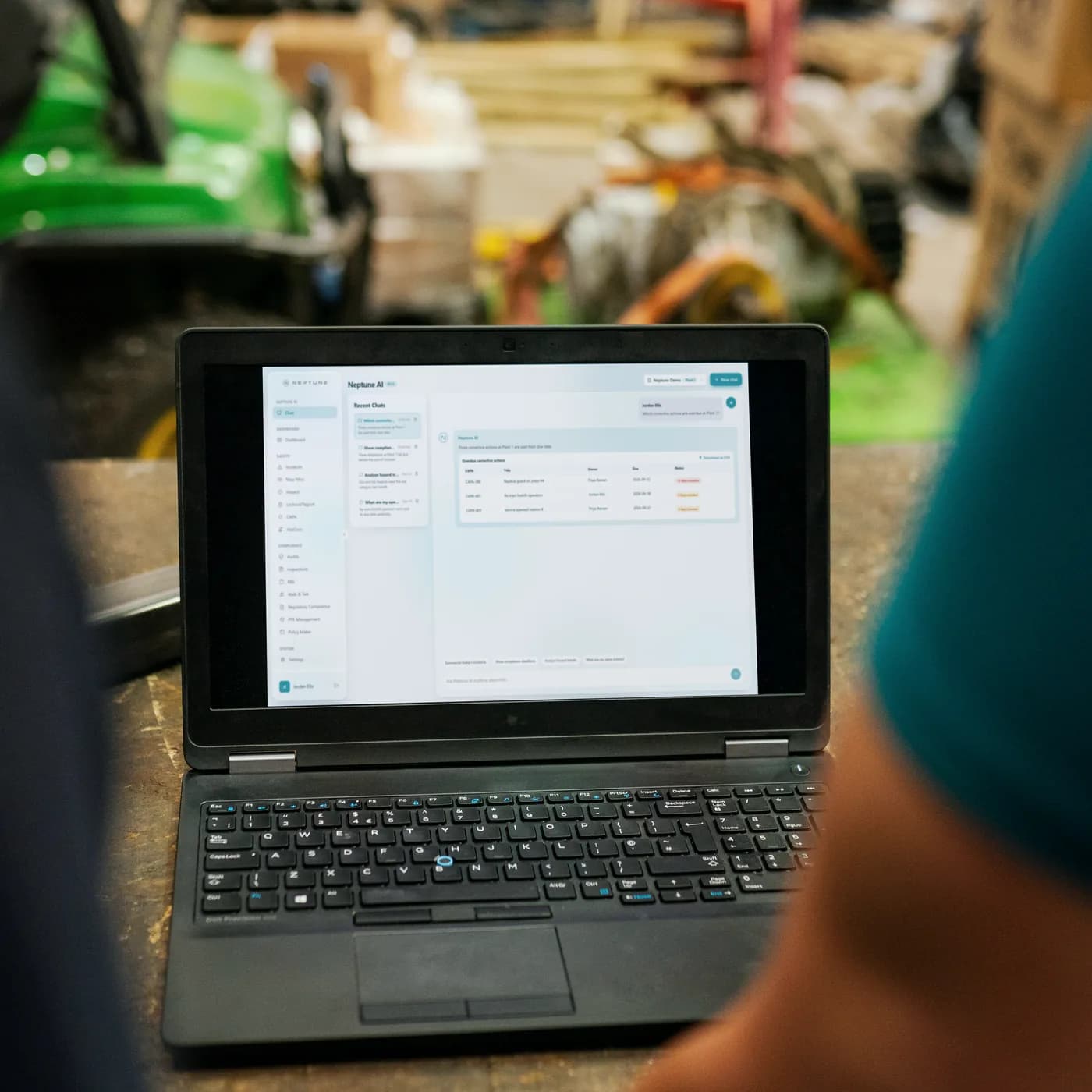 Neptune AI's answer table open on a laptop in a workshop