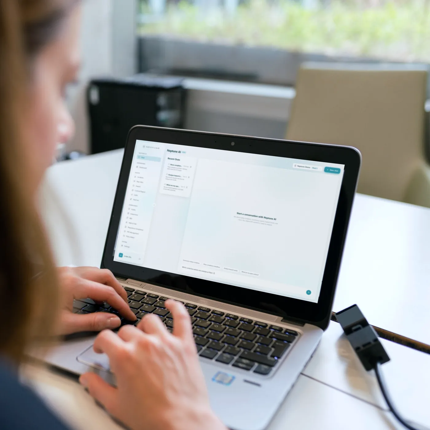 Asking Neptune AI a question on a laptop