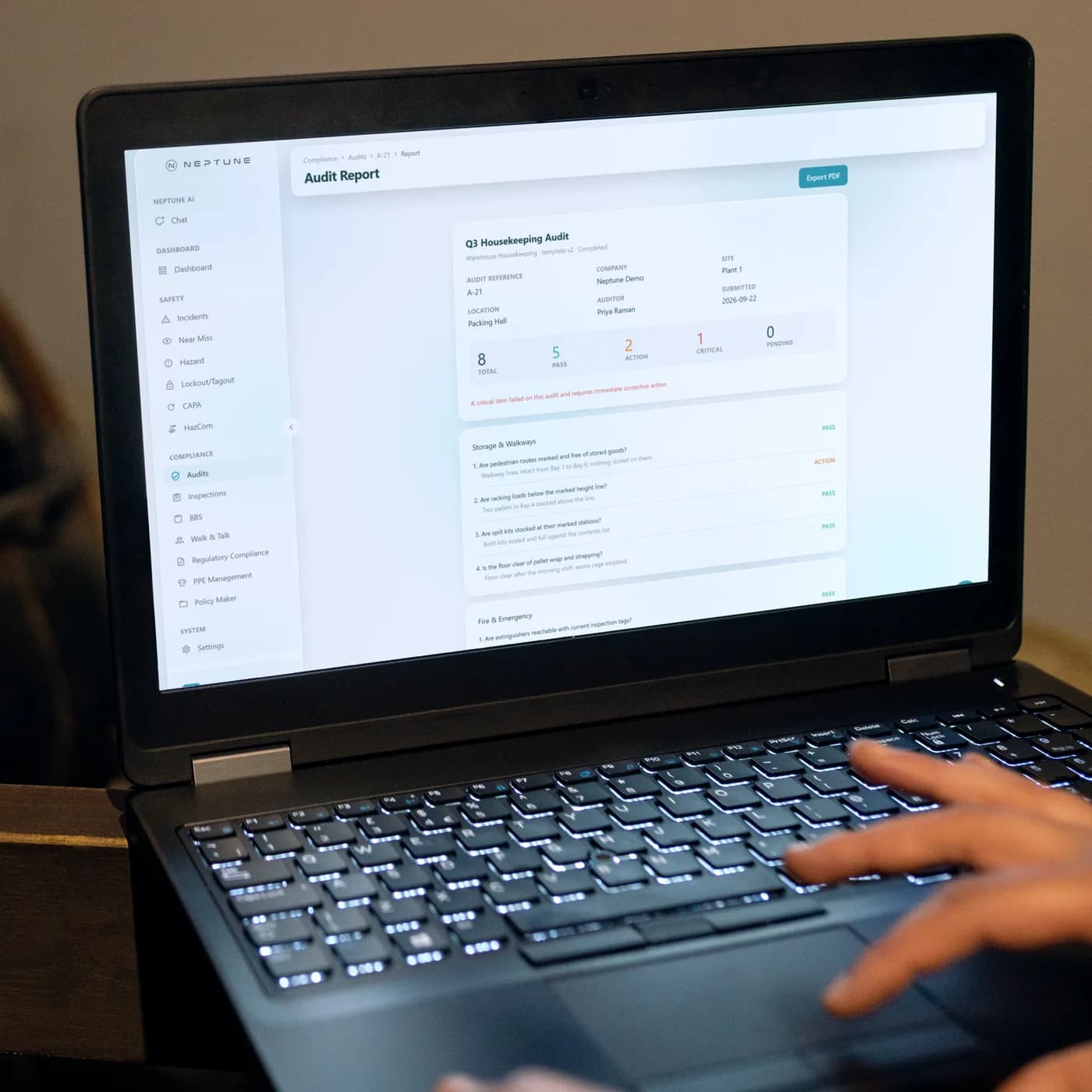 Neptune audit report with every graded question open on a laptop