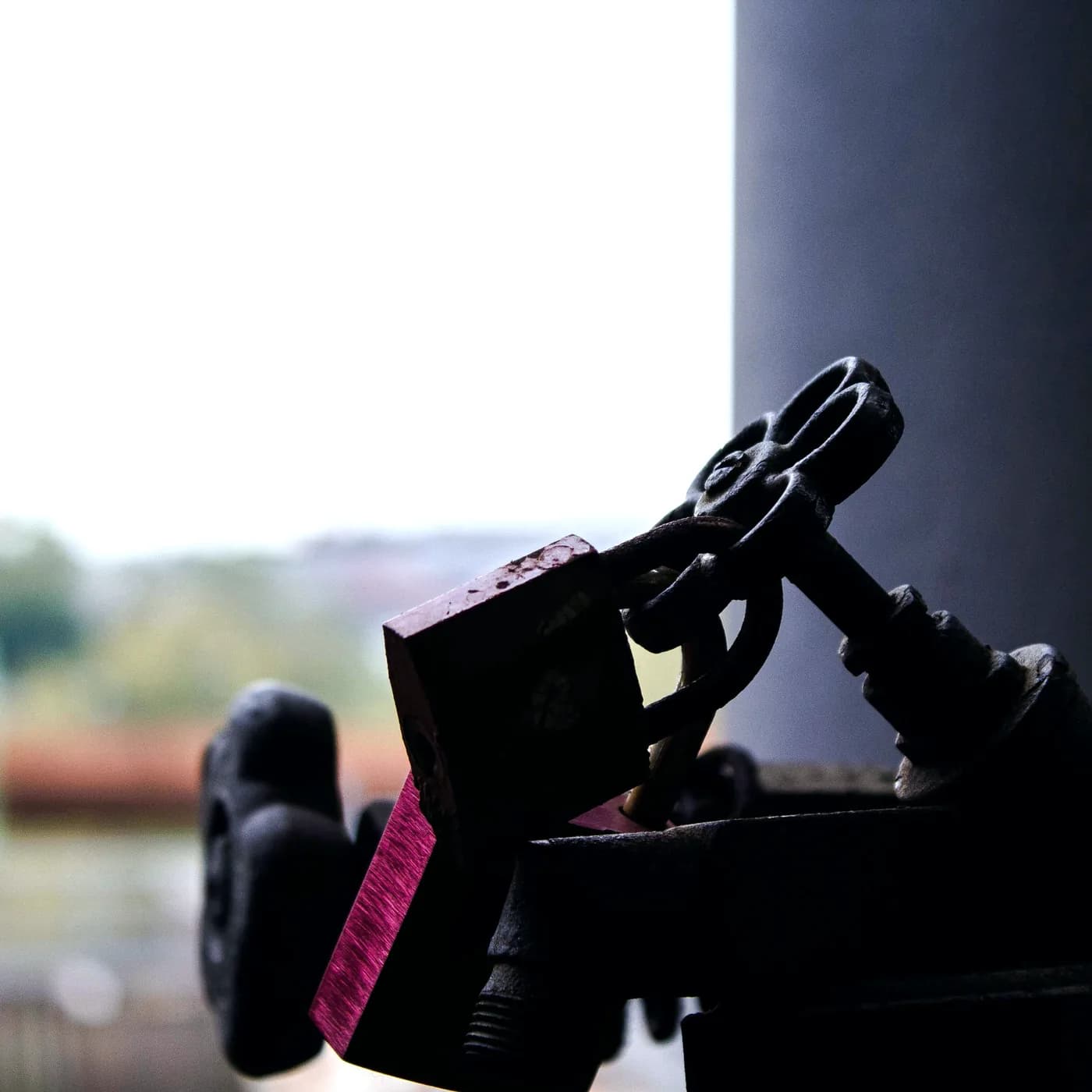 Padlock securing an industrial valve handwheel